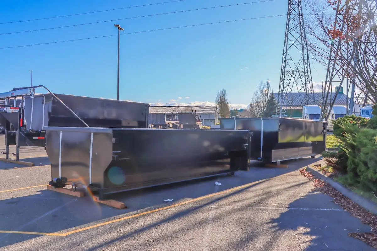 Roll-off dumpster ready for waste disposal at job site for Commercial Dumpster Rental in International Falls